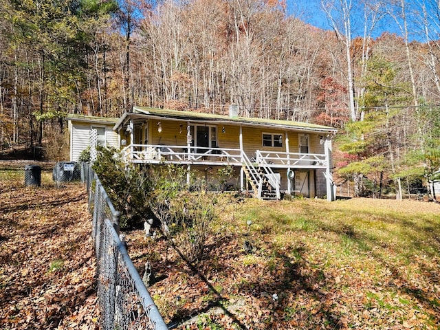 7820 Ogle Creek Rd, Covington, VA 24426 - view of front of house featuring stairway, a porch, and a forest view