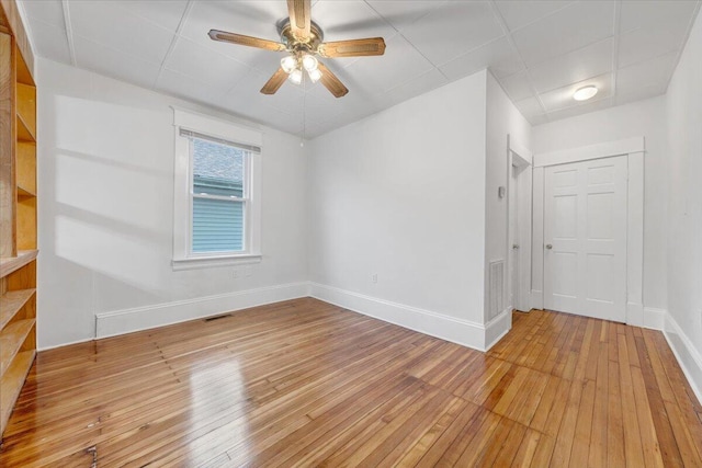 1132 Montrose Ave SE, Roanoke, VA 24013 - unfurnished room featuring light wood-type flooring, baseboards, a ceiling fan, and stairs