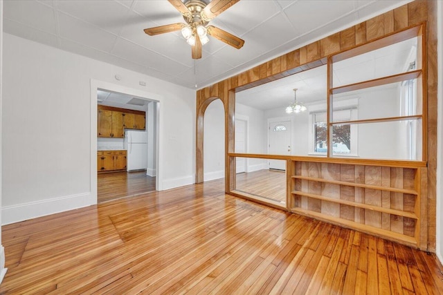 1132 Montrose Ave SE, Roanoke, VA 24013 - empty room with hardwood / wood-style flooring, a chandelier, baseboards, and ceiling fan