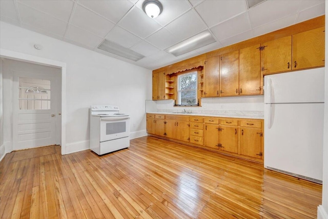 1132 Montrose Ave SE, Roanoke, VA 24013 - kitchen with white appliances, light countertops, light wood-style floors, open shelves, and a drop ceiling