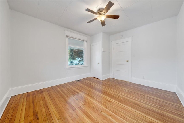 1132 Montrose Ave SE, Roanoke, VA 24013 - unfurnished room with baseboards, light wood finished floors, and a ceiling fan