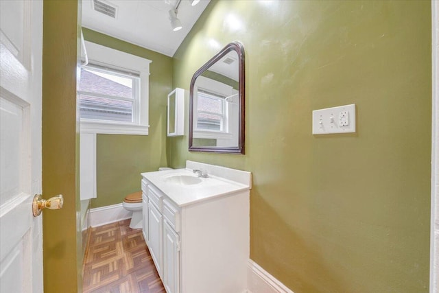 1132 Montrose Ave SE, Roanoke, VA 24013 - bathroom with toilet, vanity, and baseboards