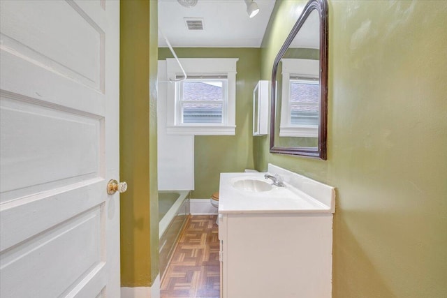 1132 Montrose Ave SE, Roanoke, VA 24013 - bathroom featuring vanity, shower / bathtub combination with curtain, baseboards, and toilet