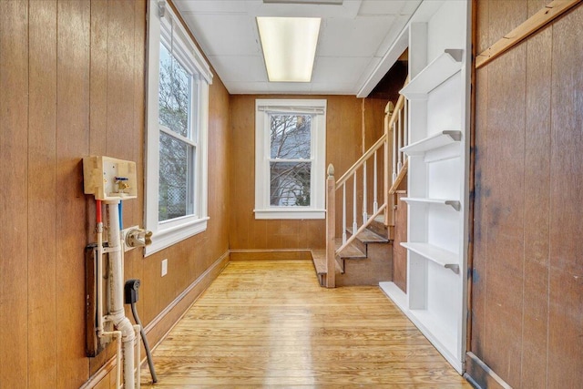 1132 Montrose Ave SE, Roanoke, VA 24013 - entryway with light wood-type flooring, stairs, and wooden walls