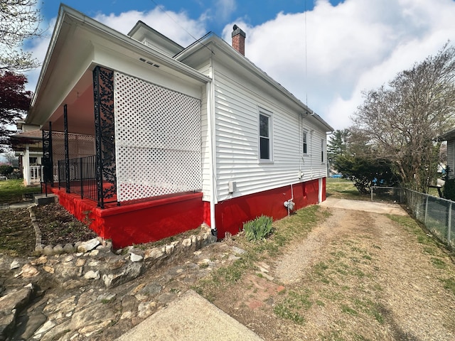 1132 Montrose Ave SE, Roanoke, VA 24013 - view of side of property featuring a chimney and dirt driveway