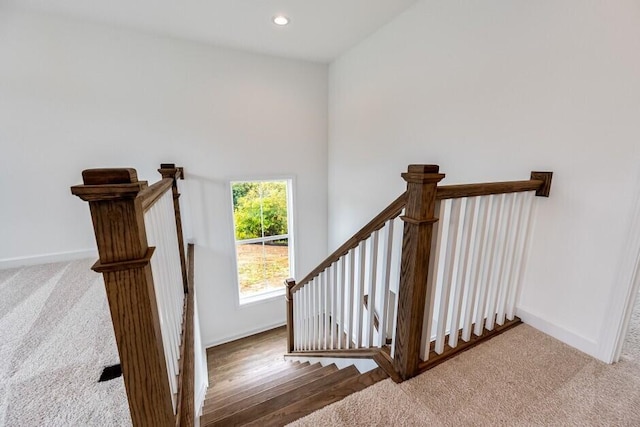 staircase featuring hardwood / wood-style flooring