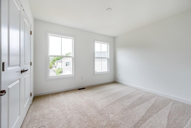 unfurnished room featuring carpet floors