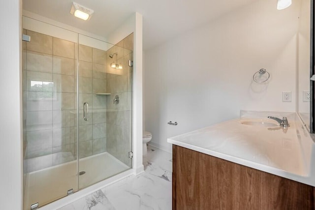 bathroom with vanity, toilet, and an enclosed shower