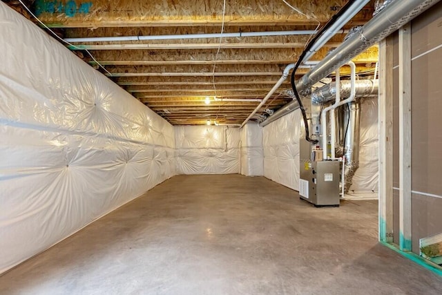 basement featuring heating unit