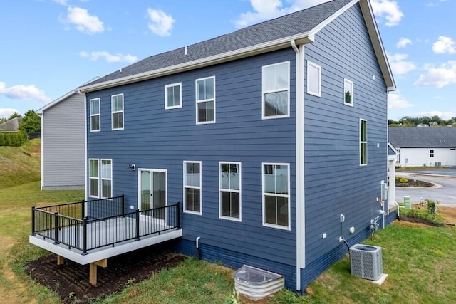 back of house with a wooden deck, a yard, and central air condition unit