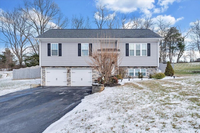 split foyer home featuring a garage