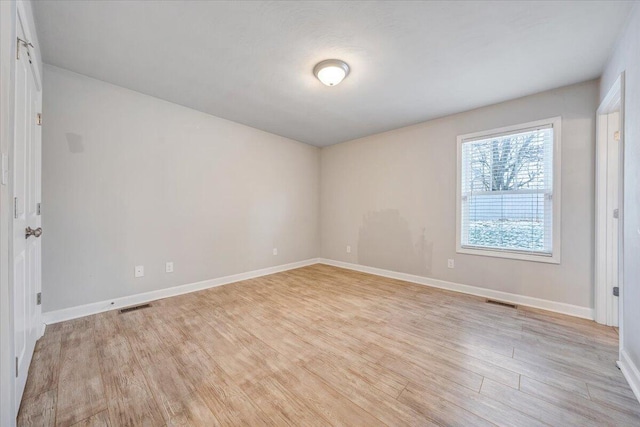 unfurnished room featuring light hardwood / wood-style flooring