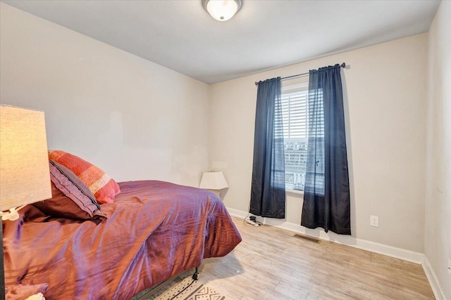 bedroom featuring light hardwood / wood-style floors