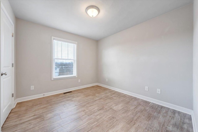 empty room featuring light hardwood / wood-style floors