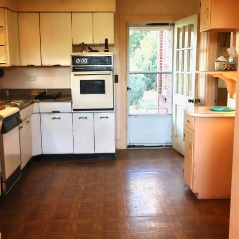 kitchen with white appliances and white cabinets