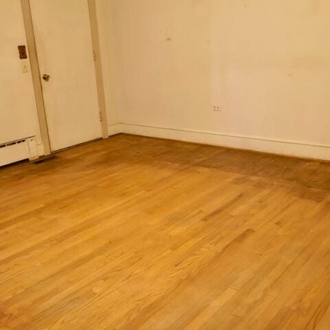 spare room with light hardwood / wood-style flooring