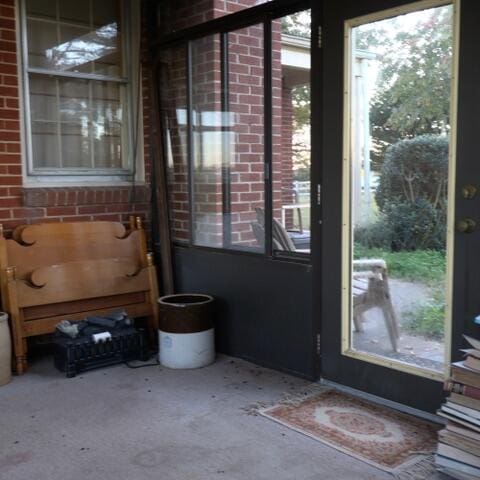 doorway to outside featuring concrete flooring