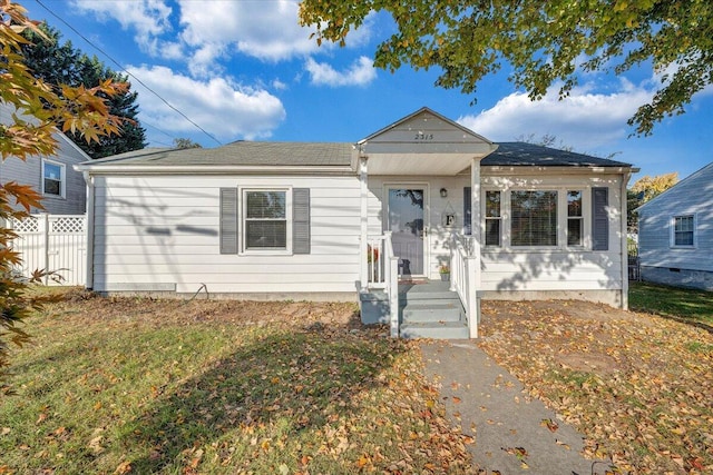 bungalow with a front lawn