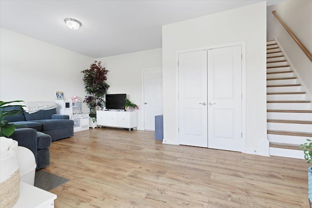 living room with light hardwood / wood-style flooring