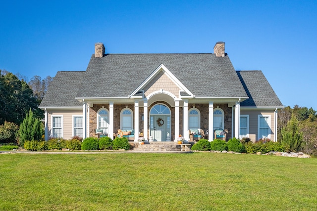 view of front of property featuring a porch and a front lawn