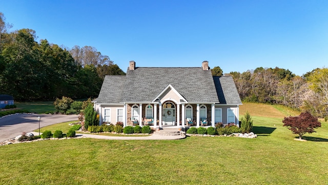 view of front of home featuring a porch and a front lawn