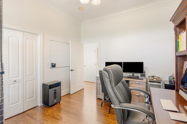 office featuring light hardwood / wood-style floors and ornamental molding