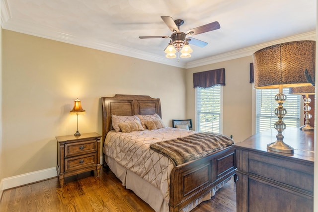 bedroom featuring ornamental molding, ceiling fan, and dark hardwood / wood-style flooring