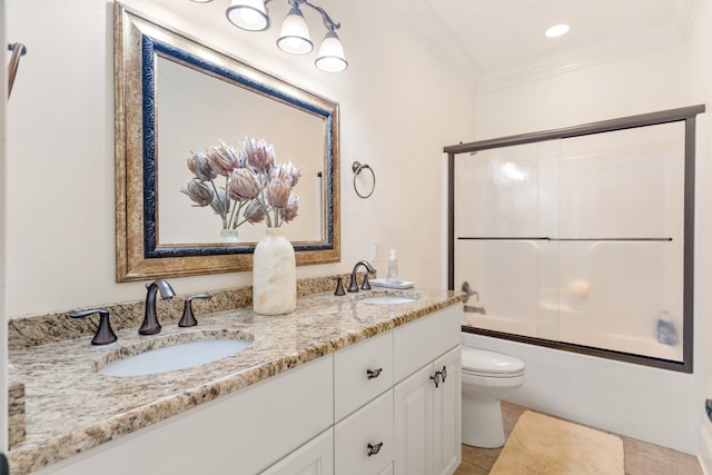 full bathroom featuring toilet, tile patterned floors, bath / shower combo with glass door, vanity, and ornamental molding