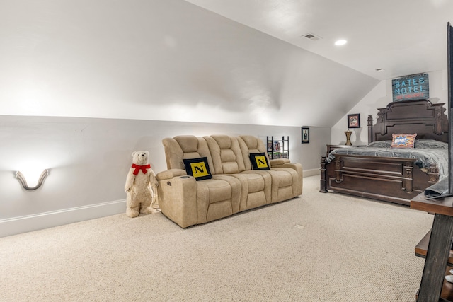 bedroom featuring lofted ceiling and carpet flooring