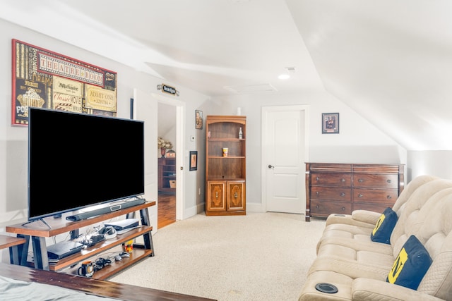 carpeted living room featuring lofted ceiling