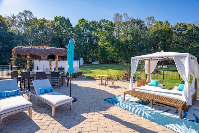 view of patio / terrace featuring a gazebo and a bar