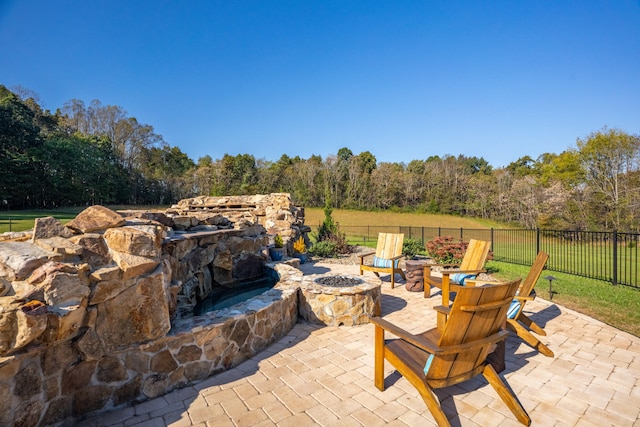 view of patio / terrace with an outdoor fire pit