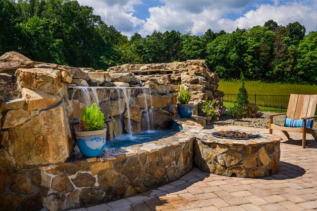 view of patio / terrace featuring an outdoor fire pit