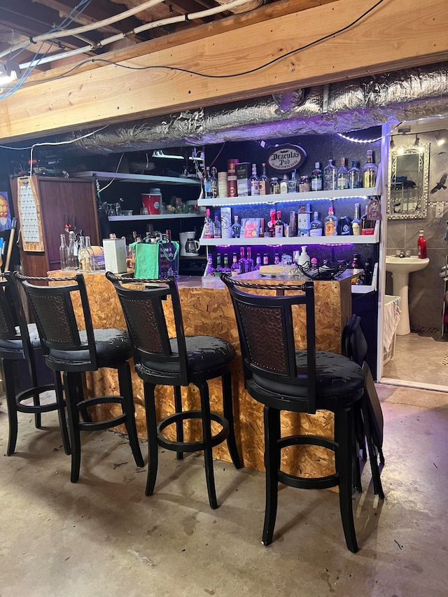 bar with concrete floors and sink