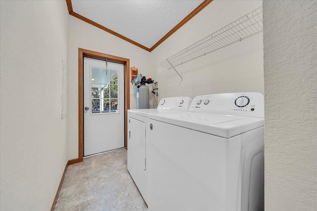 washroom with washer and dryer and a textured ceiling