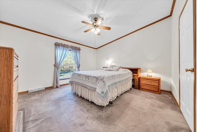 bedroom with ceiling fan, carpet floors, a textured ceiling, and ornamental molding