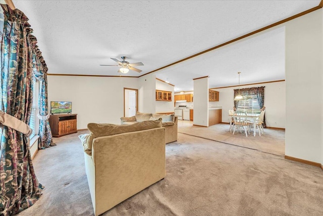 carpeted living room featuring ceiling fan, crown molding, a textured ceiling, and vaulted ceiling