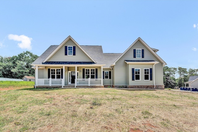 view of front of property with a front yard and a porch