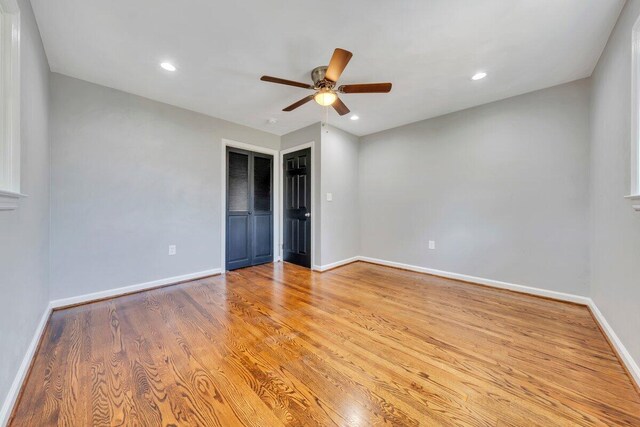 unfurnished bedroom with recessed lighting, baseboards, and light wood-style floors