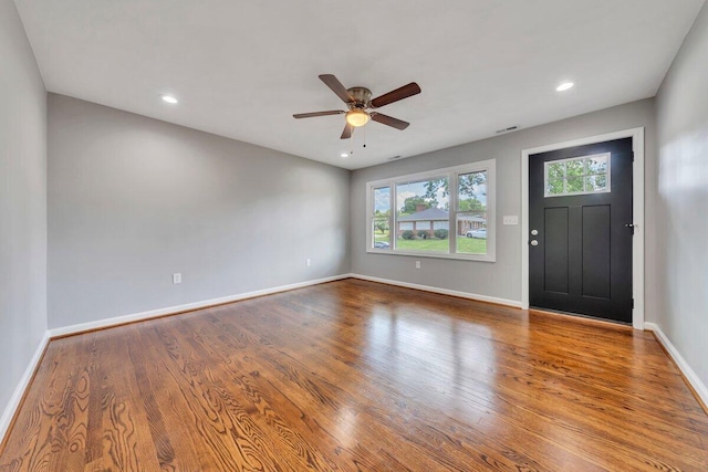 interior space featuring ceiling fan, recessed lighting, baseboards, wood finished floors, and visible vents