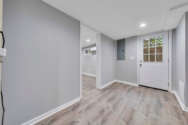 entryway featuring baseboards, electric panel, recessed lighting, and wood finished floors