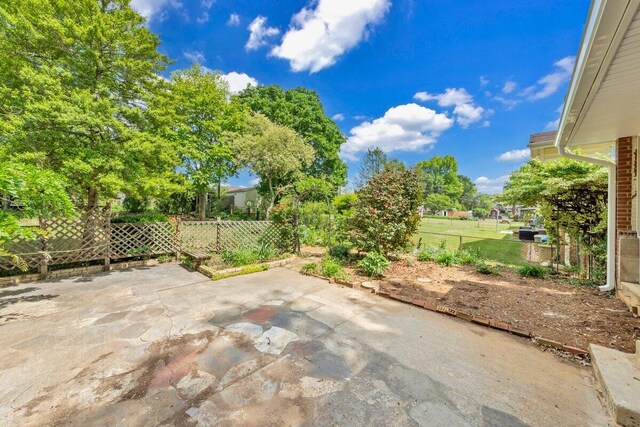 view of patio / terrace featuring fence