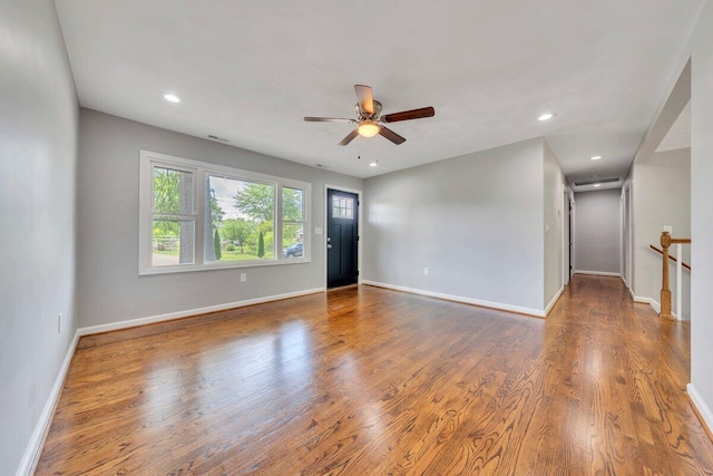 unfurnished room with baseboards, recessed lighting, ceiling fan, and wood finished floors