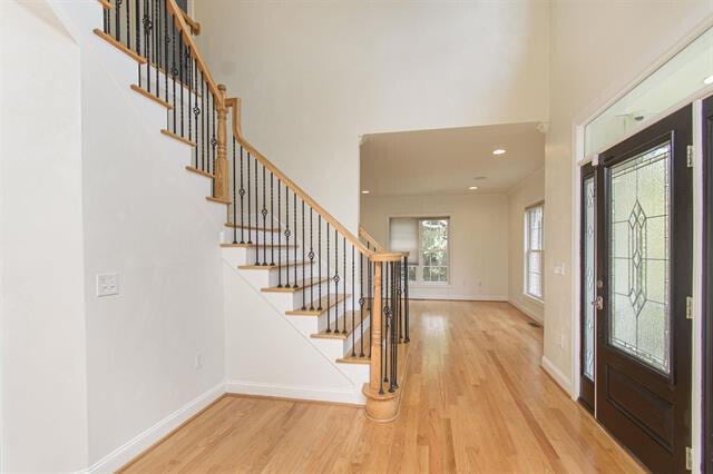 entryway featuring hardwood / wood-style floors and plenty of natural light