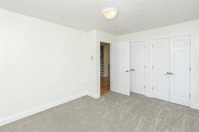 unfurnished bedroom with carpet floors