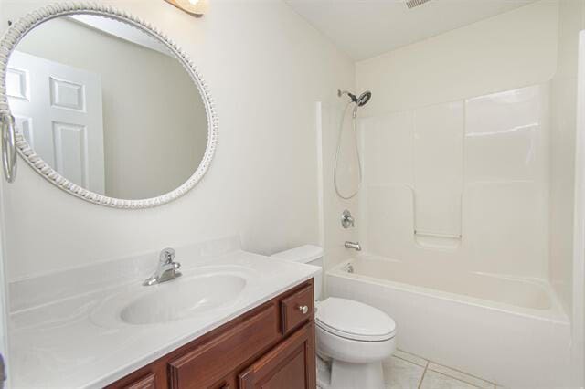 full bathroom featuring toilet, shower / bathing tub combination, vanity, and tile patterned floors