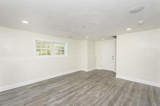 unfurnished room featuring dark hardwood / wood-style floors