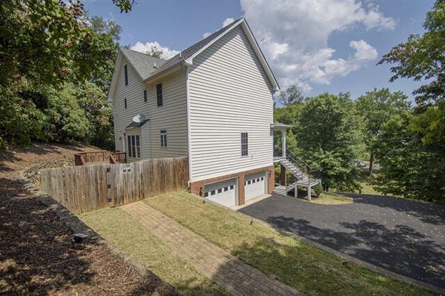 view of property exterior with a garage