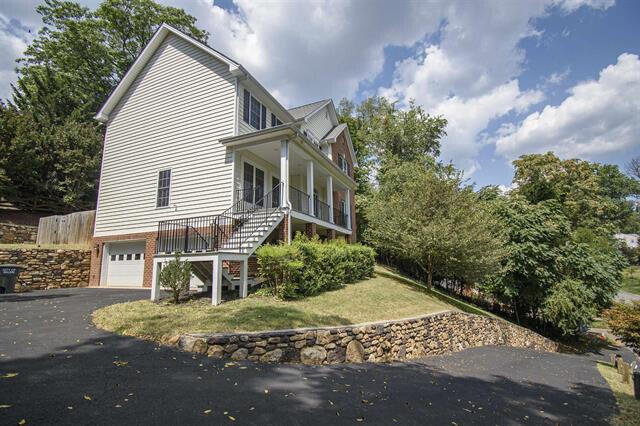 view of side of home with a garage