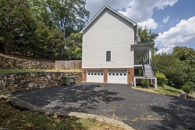 view of property exterior with a garage